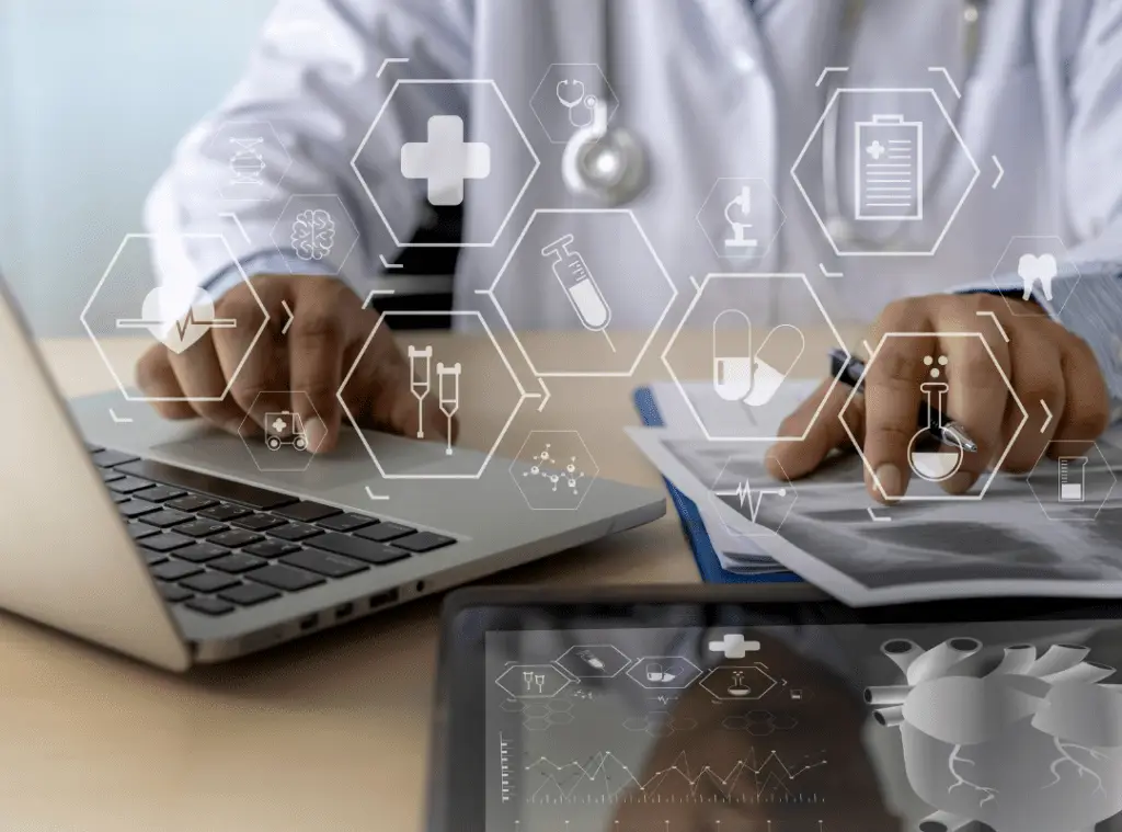 Doctor working on a laptop, reviewing papers. Transparent medical icons, like capsules and stethoscope, overlay the image, suggesting digital health technology.